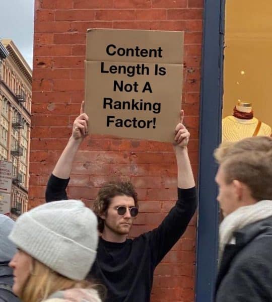Man holding placard saying "Content length is not a ranking factor."